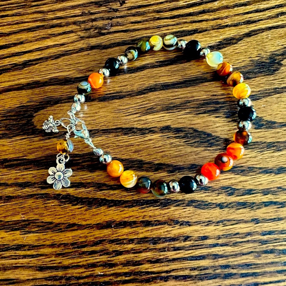 Handcrafted bracelet made with bumblebee agate and sterling silver charms. - Picture 1 of 4